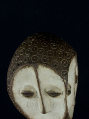 Ритуальная маска народности Lega с двойным лицом